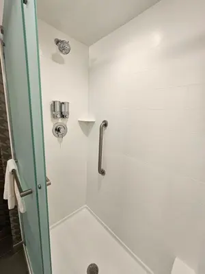 a shower with a glass door in a bathroom at Home2 Suites By Hilton Allentown Bethlehem Airport in Bethlehem