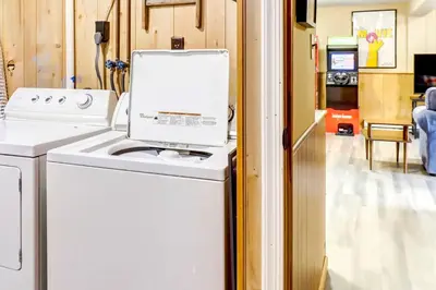 a white washer and dryer in a room at Pet-Friendly Home with Deck at Big Bass Lake! in Gouldsboro