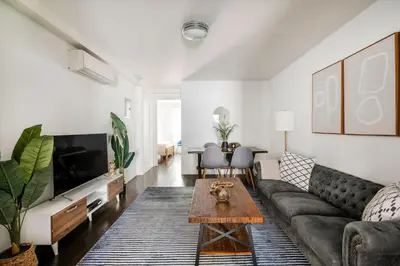 a living room with a couch and a coffee table at 39-2 Renovated 3BR Prime Hudson Yards Area in New York