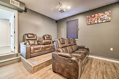 two leather chairs and a couch in a living room at Movie Room, Hot Tub Pocono Vacation Rental! in East Stroudsburg