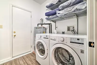 a laundry room with a washer and dryer at Movie Room, Hot Tub Pocono Vacation Rental! in East Stroudsburg