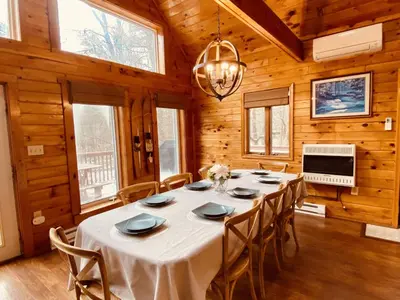 a large dining room with a table and chairs at Knoll by the Lake-7 minutes to skiing in Lake Harmony