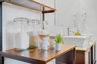 four glass jars on a wooden counter in a kitchen at World Cup 2026 Luxury Industrial Loft in Philadelphia