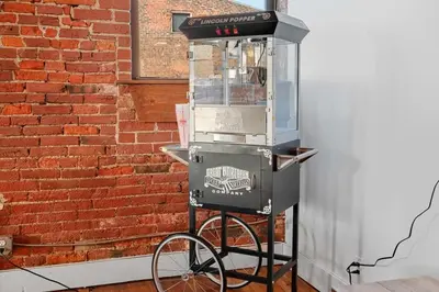 a barbecue grill on a stand next to a brick wall at World Cup 2026 Luxury Industrial Loft in Philadelphia