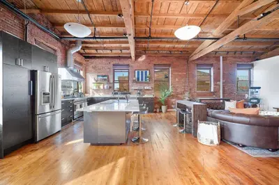 a large kitchen with a couch and a counter top at World Cup 2026 Luxury Industrial Loft in Philadelphia