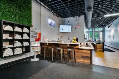 a store with a counter and stools in a room at The Liberty Suite Residence in Philadelphia