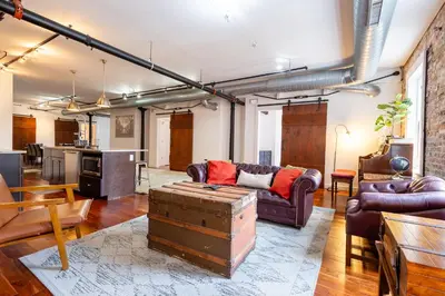 a living room with a couch and a table at The Liberty Suite Residence in Philadelphia