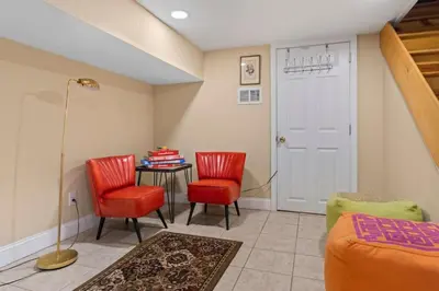 a room with two chairs and a table and a door at Fairmount Neighborhood Gem in Philadelphia