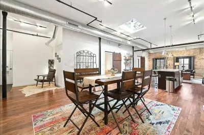 a dining room with a table and chairs at The Heritage Suite Central Old City Near the Liberty Bell in Philadelphia