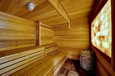 a wooden sauna with a bench in the corner at The Heritage Suite Central Old City Near the Liberty Bell in Philadelphia