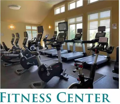 a fitness center with treadmills and exercise bikes at Modern 5 Bedroom Pocono house - Jacuzzi - Gameroom - Near Lake - Golf Couse in Tobyhanna