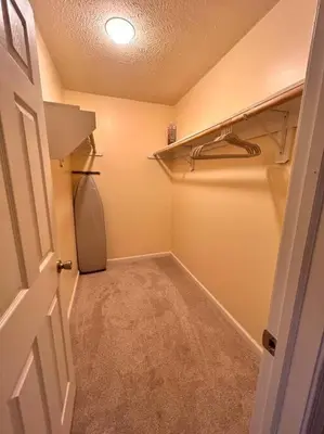 a room with a walk in closet with a refrigerator at Modern 5 Bedroom Pocono house - Jacuzzi - Gameroom - Near Lake - Golf Couse in Tobyhanna