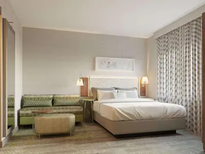 a bedroom with a large bed and a couch at Home2 Suites By Hilton New York Times Square in New York