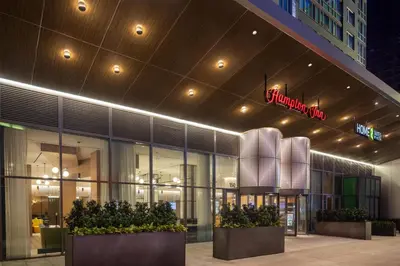 a store front of a building with plants in front at Home2 Suites By Hilton New York Times Square in New York