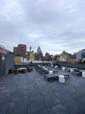 a group of benches on a roof of a building at Modern Spacious Apartment in Chelsea in New York