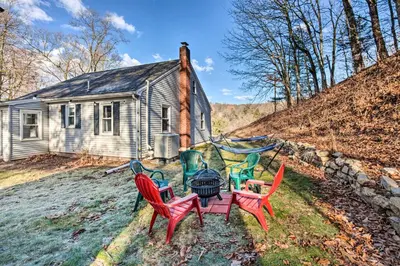 a group of chairs sitting in front of a house at Pet-Friendly Mohnton House Near Golf Course! in Mohnton