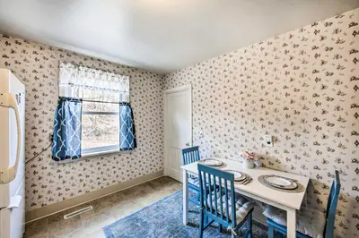 a dining room with a table and chairs and a window at Pet-Friendly Mohnton House Near Golf Course! in Mohnton