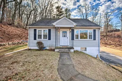 a small white house with a door on a yard at Pet-Friendly Mohnton House Near Golf Course! in Mohnton