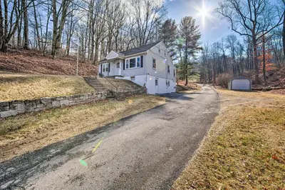 a white house on the side of a road at Pet-Friendly Mohnton House Near Golf Course! in Mohnton