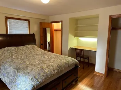 a bedroom with a bed and a desk and a chair at J2 Pleasant Queens Size room near St. Peter's hospital & New Brunswick Downtown in New Brunswick