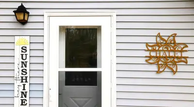 a door to a house with a sign on it at Cozy Pocono Getaway In Arrowhead Lake in Thornhurst