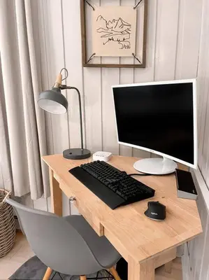 a desk with a computer monitor and a keyboard and mouse at Stylish and Cozy Cabin, Walking Distance to Big Bass Lake in Gouldsboro