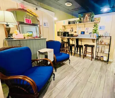 a restaurant with chairs and a counter with a bar at New York Spirit Retreats HOSTEL in New York