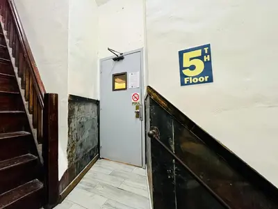 a floor elevator with a sign on the wall at New York Spirit Retreats HOSTEL in New York