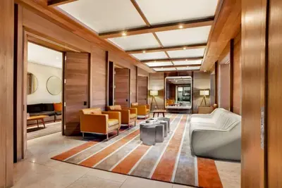 a living room with a couch and chairs at Rector Place in New York