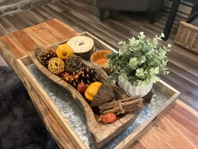 a tray of food on a table with a plant at Peaceful Seasonal Wooded Cottage close to everything in Tafton