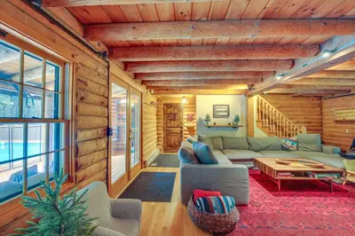 a living room with a couch and a table at Accord Vacation Rental with Pool and Hot Tub! in Accord