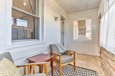 a living room with chairs and a table and a window at Philadelphia Home Rental Near Center City! in Philadelphia