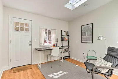 an apartment with a desk and chairs in a room at Philadelphia Home Rental Near Center City! in Philadelphia