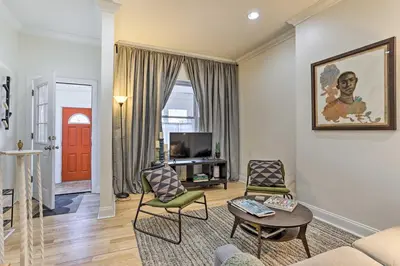 a living room with a couch and chairs and a tv at Philadelphia Home Rental Near Center City! in Philadelphia