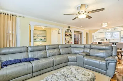 a leather couch in a living room with a ceiling fan at Family Vacation Rental 18 Mi to Philadelphia in Gibbstown