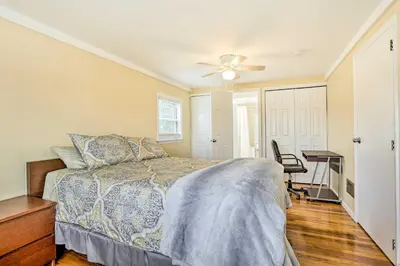 a bedroom with a bed and a ceiling fan at Family Vacation Rental 18 Mi to Philadelphia in Gibbstown