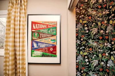 a picture hanging on a wall next to a curtain at Hot Cocoa Bar 4 Season Porch wWood Stove in Pocono Country Place