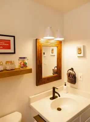 a bathroom with a sink and a mirror at Lake Naomi Chalet - 2hrs from NYC in Pocono Pines