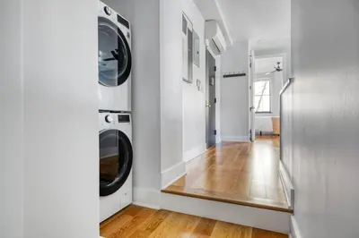 a laundry room with a washer and dryer on the wall at West Village 3br w wd nr Pier 46 NYC-1098 in New York