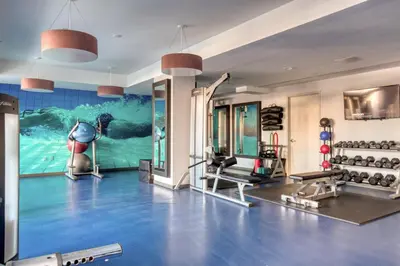 a fitness room with a gym with a dolphin mural at Hoboken 2BR w PATH Shuttle Gym WD NYC-813 in Hoboken