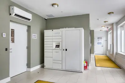 a hospital hallway with a white machine in a room at Jersey City 2BR w wd roof gym nr Path NYC-962 in Jersey City