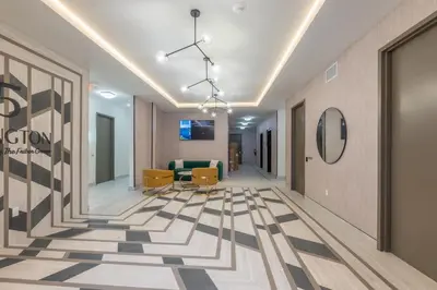 a corridor of an office building with a lobby at Emerald Escape, Free Parking, 2 Bath, Sleeps 8 Near American Dream and The Airport, King Bed and 2 Queen Beds, Washer and Dryer in Orange