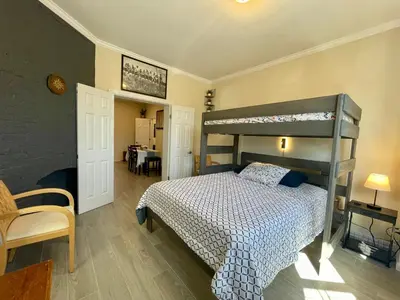 a bedroom with a bunk bed and a table at New York City Private Bedroom Near The Free Ferry Boat! in Stapleton