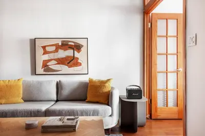 a living room with a couch and a table at Nolita 2br w wd nr SoHo NYC-992 in New York