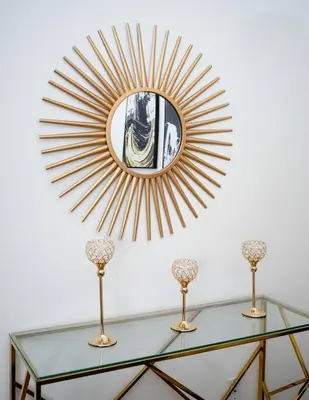 a mirror on a wall above a glass table at Spacious studio in Brooklyn Heights in Brooklyn