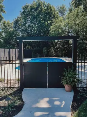 a black gate with a pool inside of it at Ode to the '70's creative private home with pool in Honey Brook
