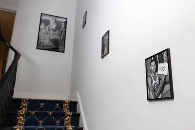 a group of pictures hanging on a wall at Thena Hotel - Ground Floor 1 Bedroom Suite in Philadelphia