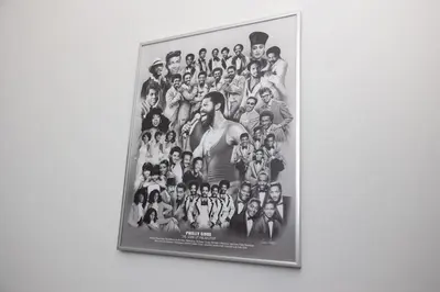 a framed picture of a group of people on a wall at Thena Hotel - Spacious 1 Bedroom - City Center in Philadelphia