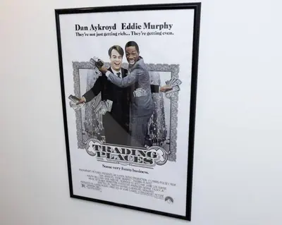 a picture of a framed poster of the beating player at Thena Hotel - Spacious 1 Bedroom - City Center in Philadelphia