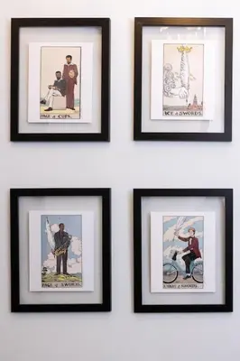 a group of framed pictures hanging on a wall at Thena Hotel 2nd Floor Studio Unit4 in Philadelphia